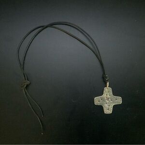 Silver cross on leather